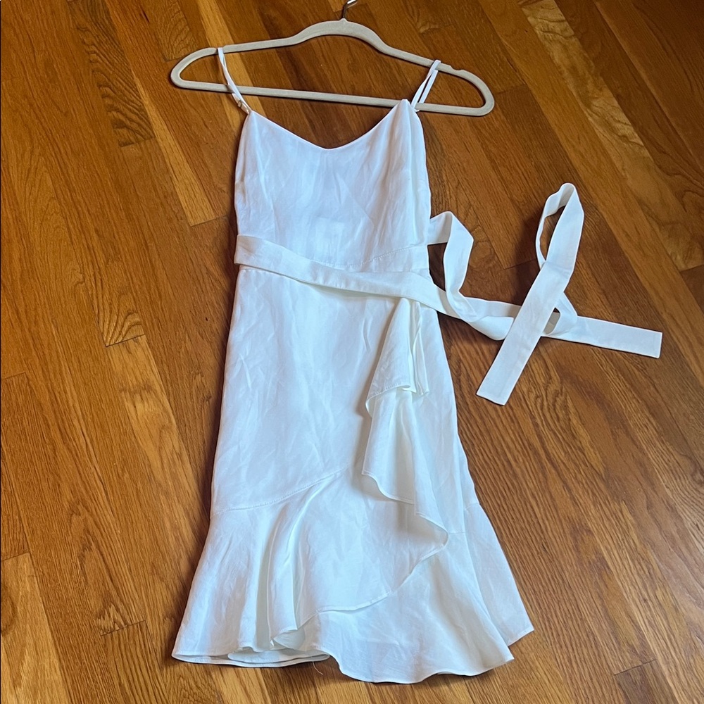 Elegant White Sleeveless Dress with Ruffle Hem
